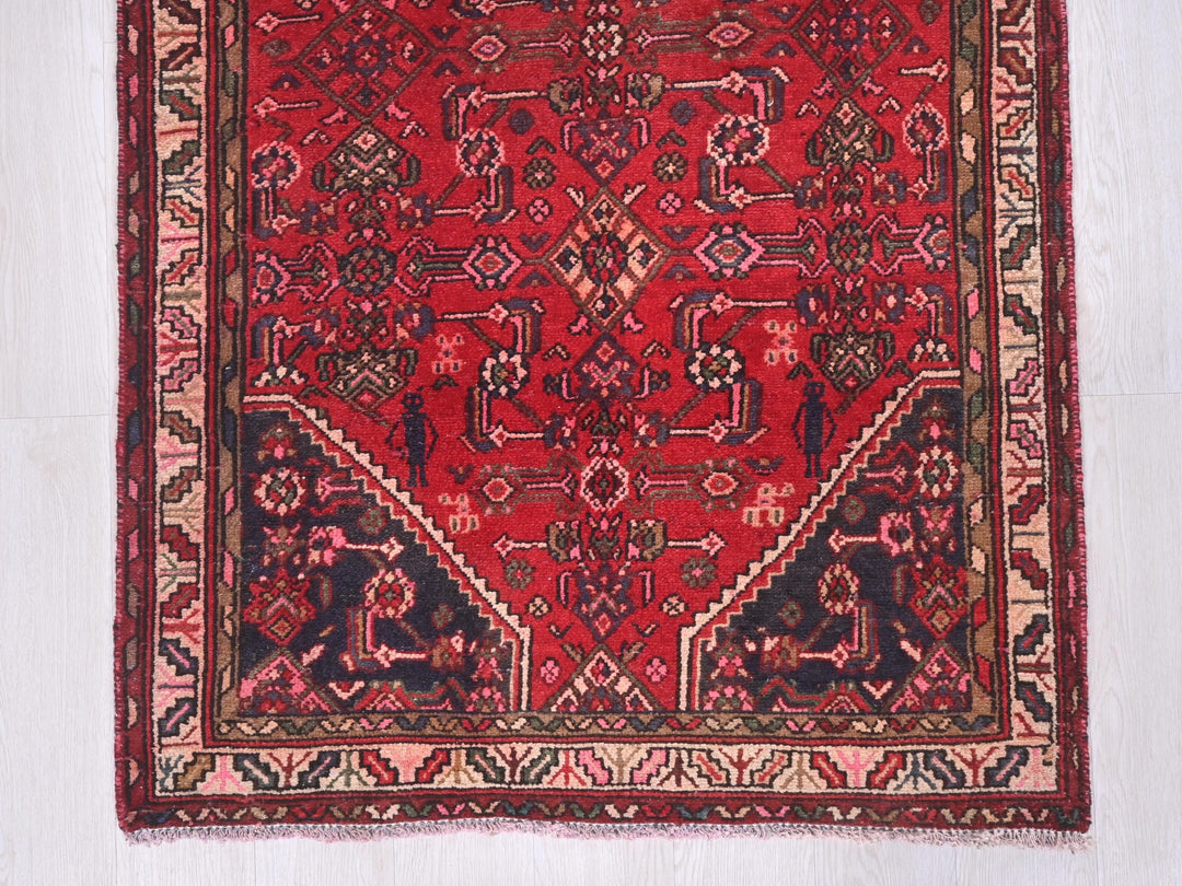 a red rug on a white floor