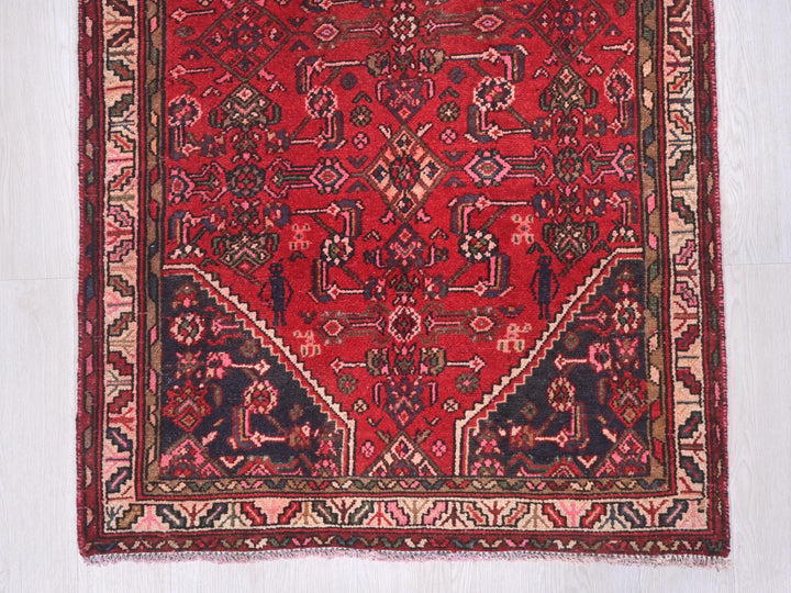 a red rug on a white floor