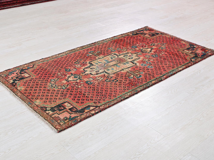 a red rug on a white floor in a room