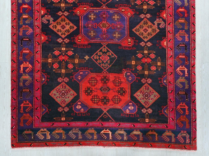 an oriental rug with a red center and a blue center