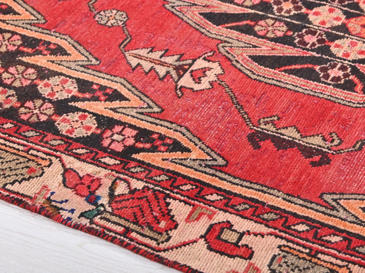 a close up of a rug on a wooden floor
