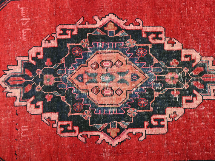 a close up of a rug with a red background