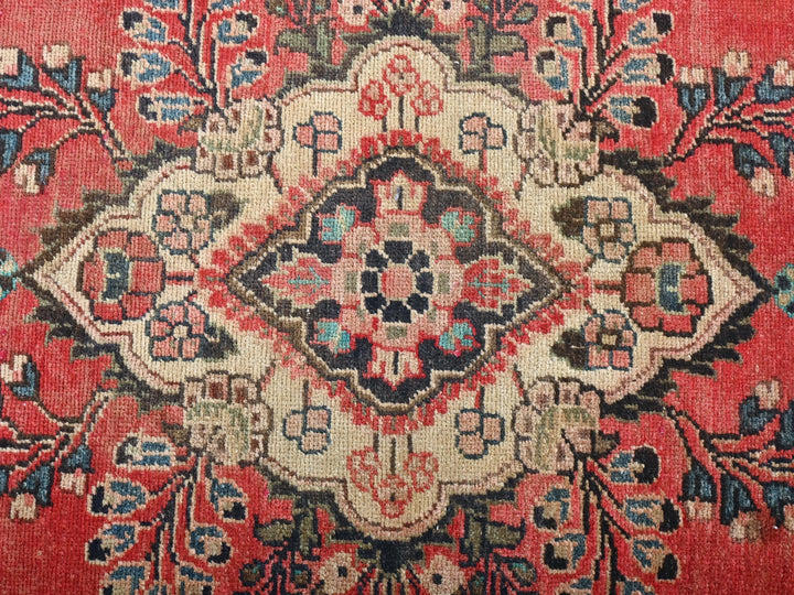 a close up of a rug with a red background