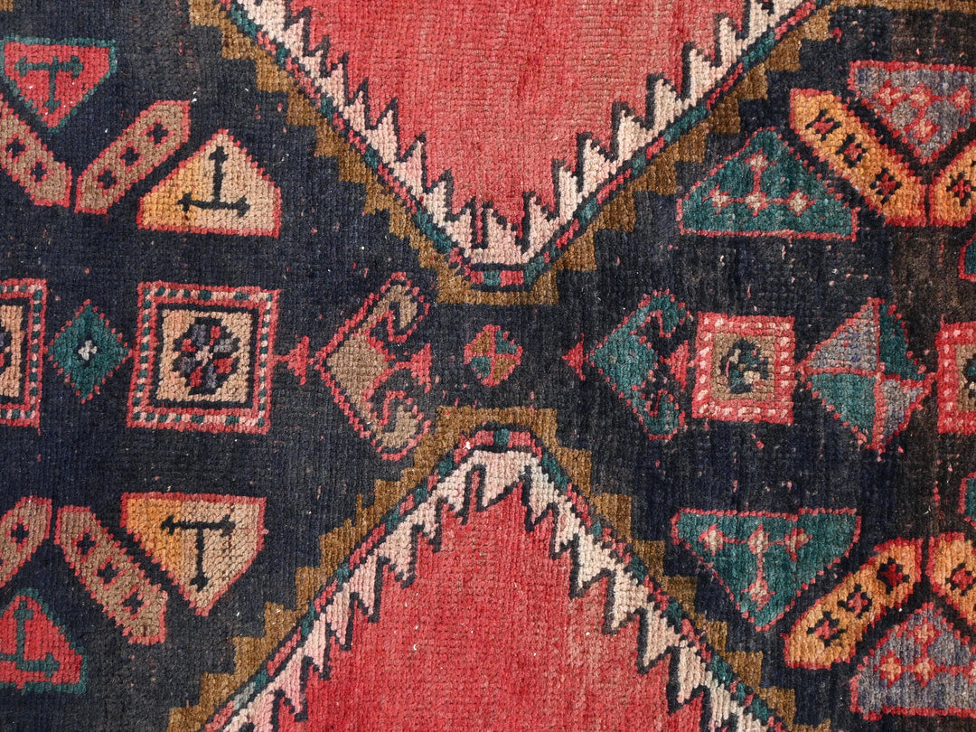 a close up of a colorful rug with a design on it