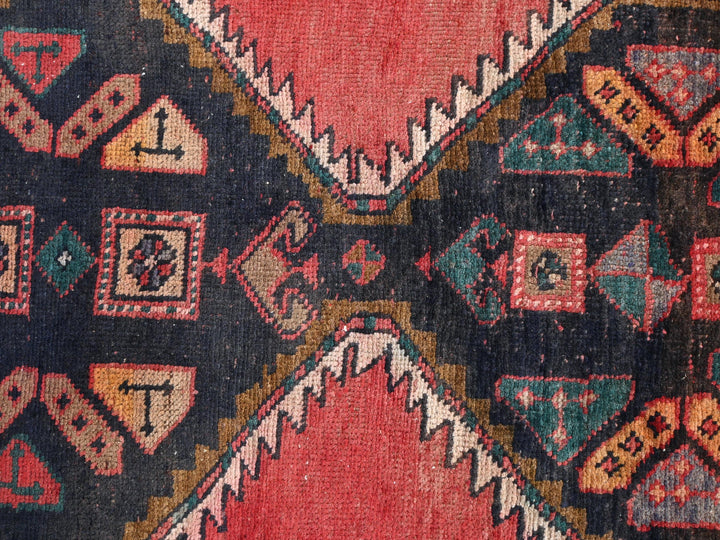 a close up of a colorful rug with a design on it