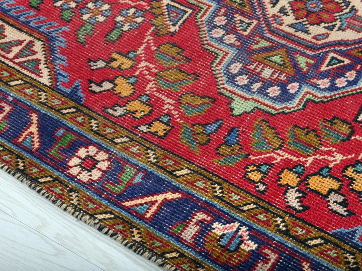 a close up of a colorful oriental rug
