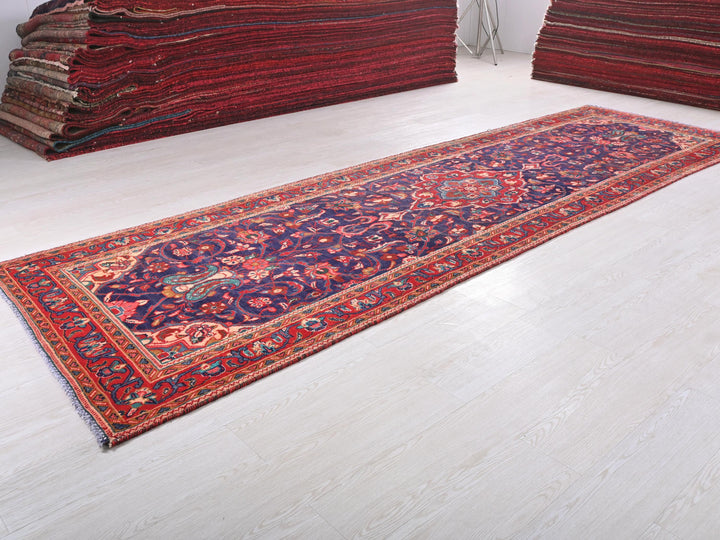a pile of rugs on the floor in a room
