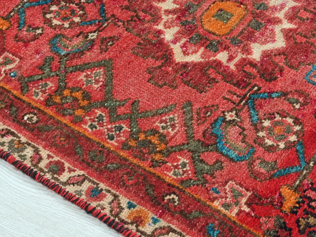 a close up of a red oriental rug