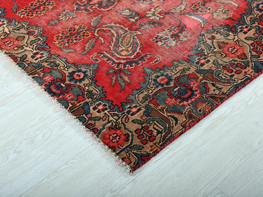 a red and blue rug on a white floor