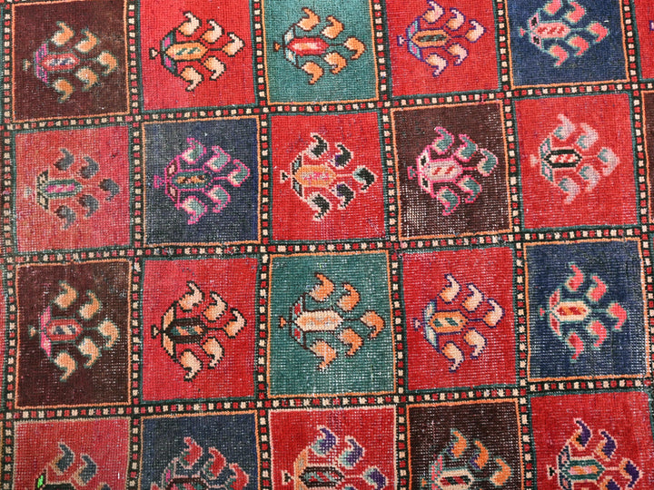 a multicolored area rug with many different designs