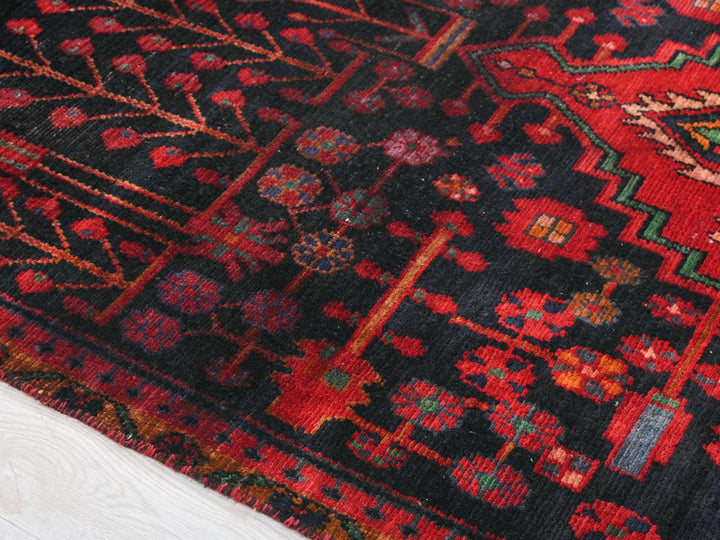 a close up of a rug on a wooden floor