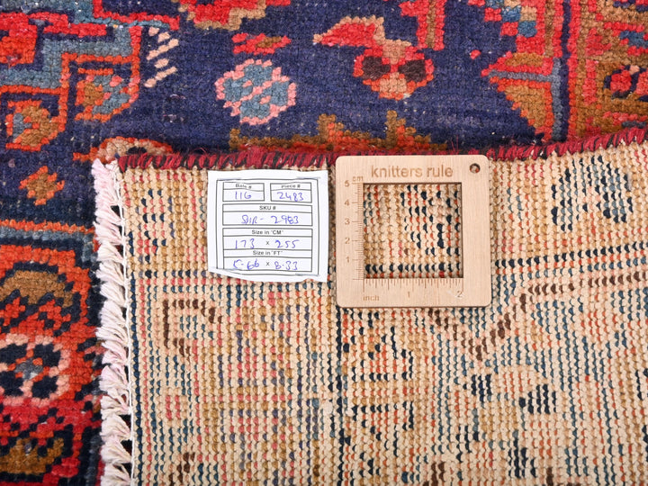 a pile of rugs with a tag on one of them