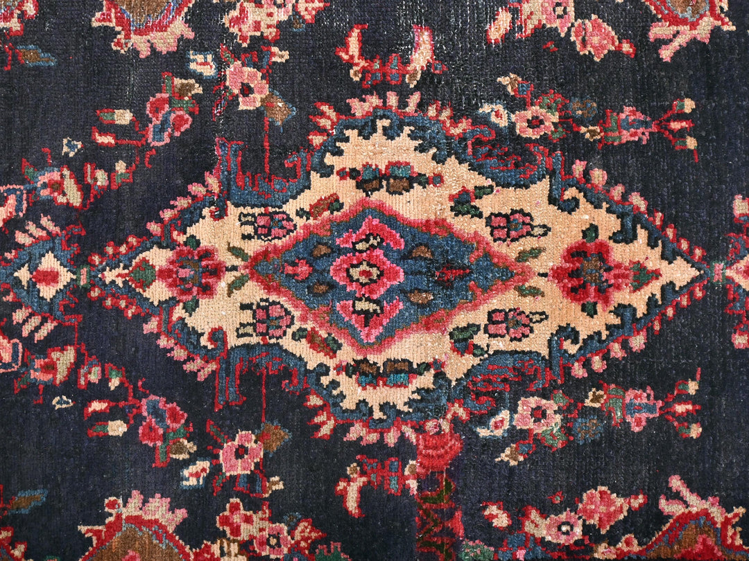 a blue rug with a red and blue design on it