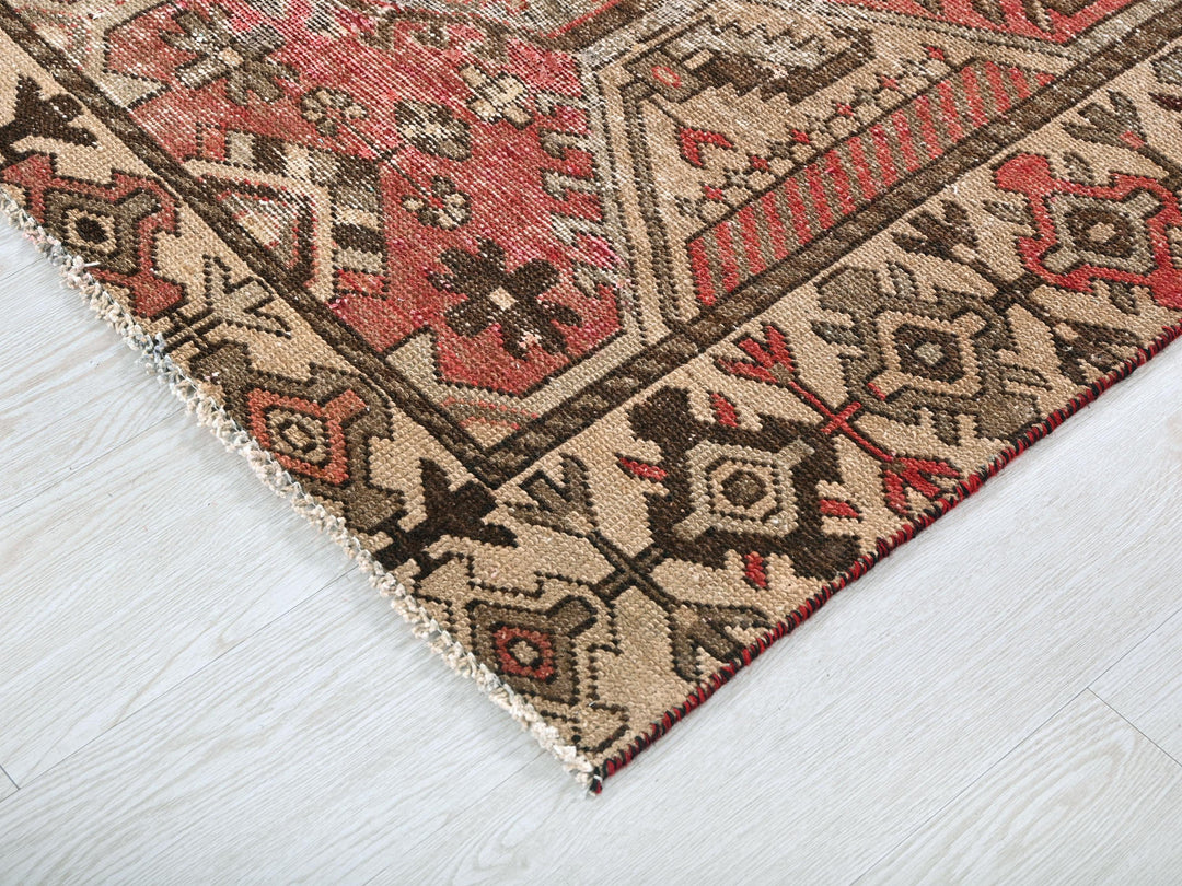 a close up of a rug on a wooden floor