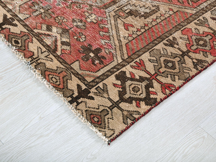 a close up of a rug on a wooden floor