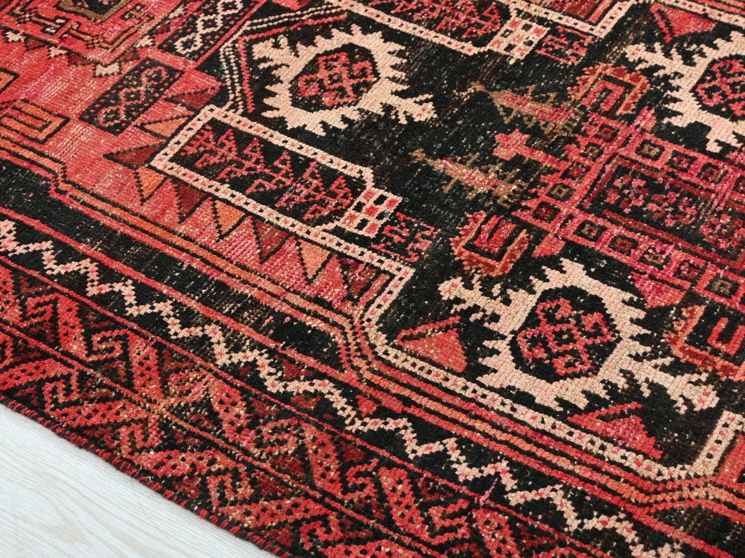 a close up of a rug on a wooden floor