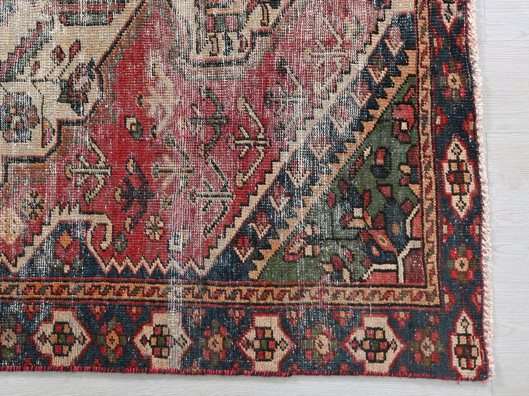 a rug with a red, blue, and green design on it