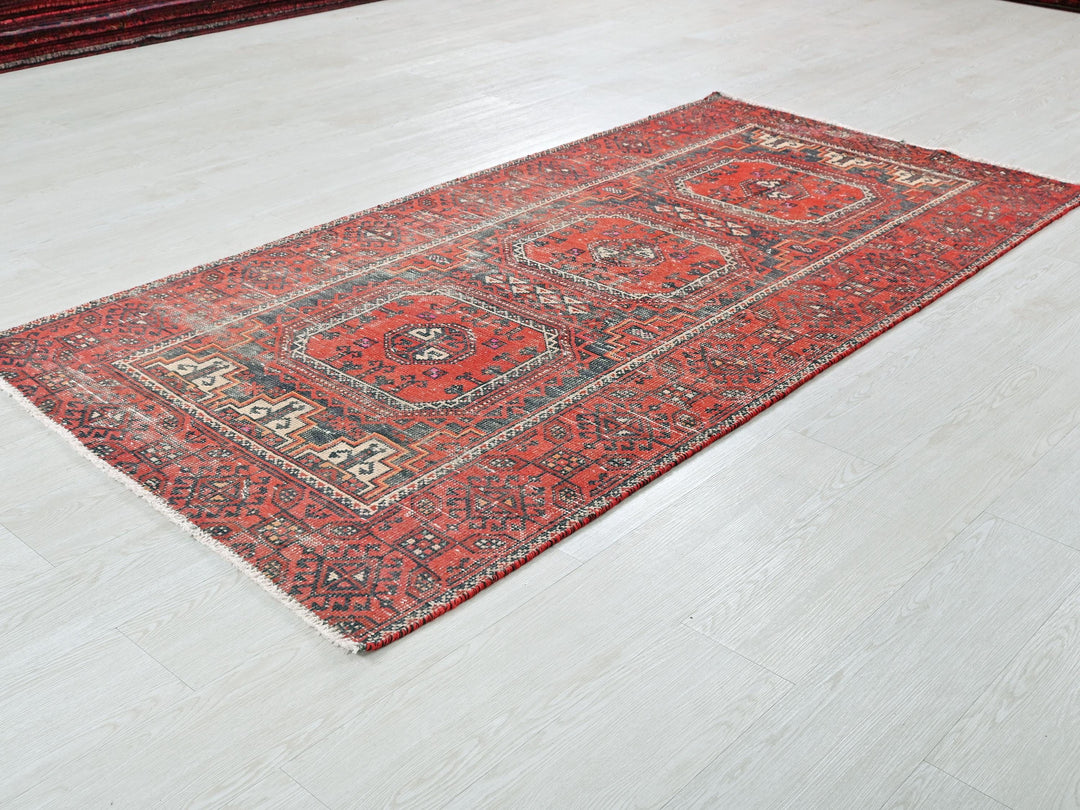 a red rug is laying on the floor