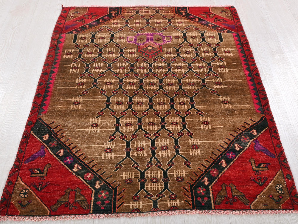 a brown and red rug on a white floor