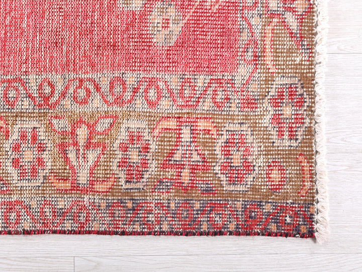 a close up of a rug on a wooden floor