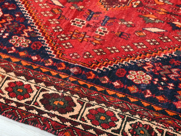 a close up of a rug on a wooden floor