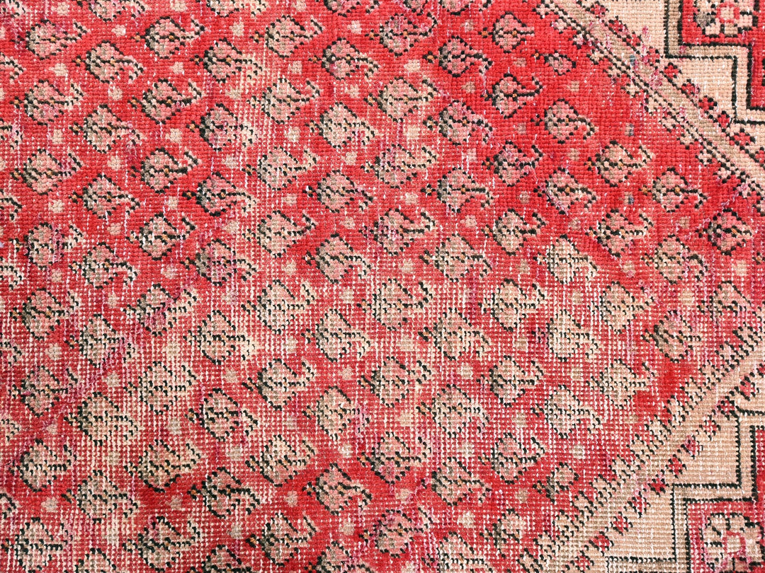 a close up of a red and black rug