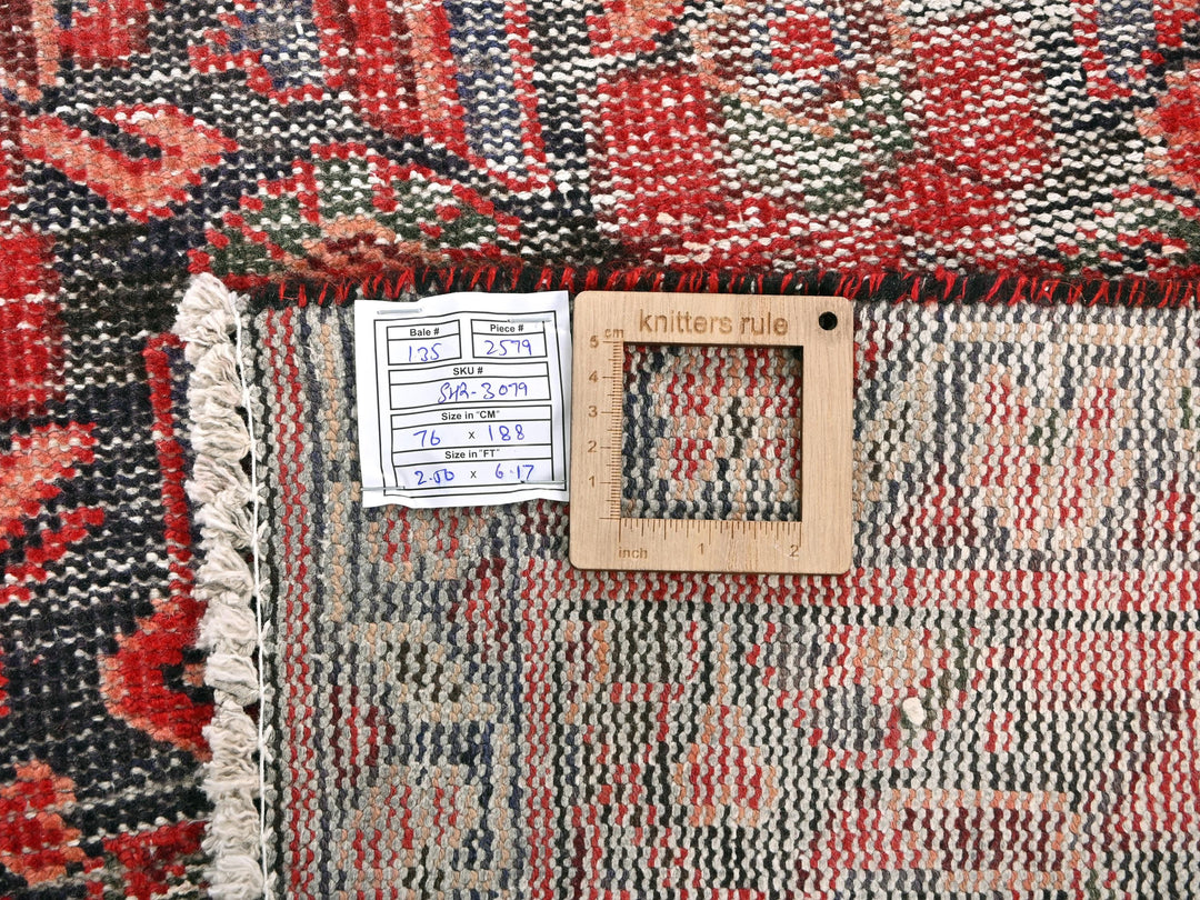 a piece of wood sitting on top of a rug