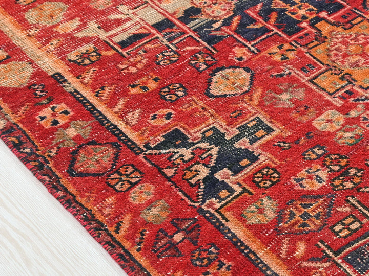 a close up of a rug on a wooden floor