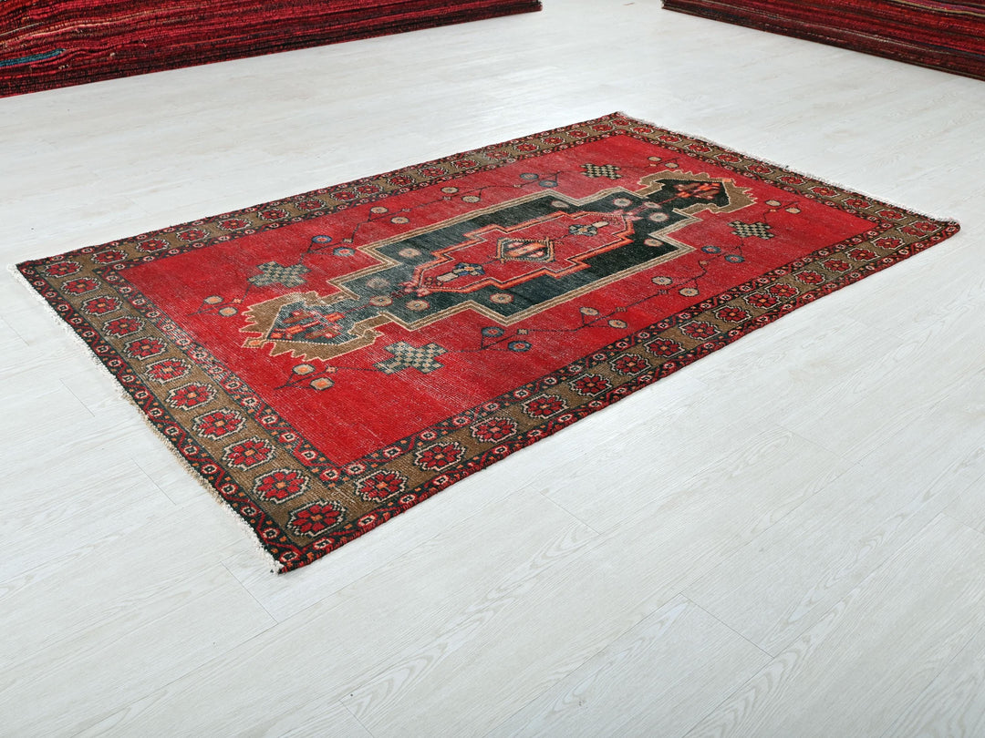 a red rug on the floor of a room