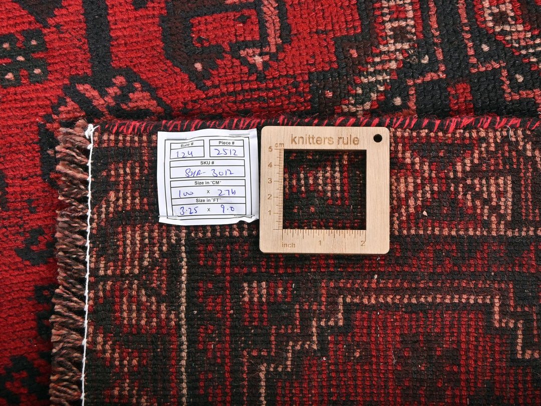 a close up of a rug with a wooden frame