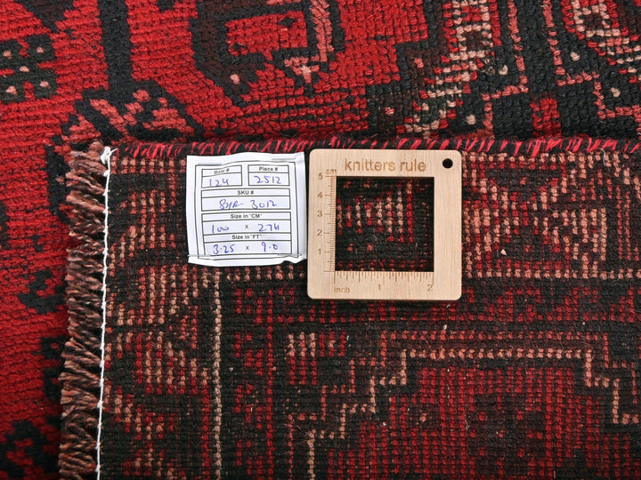 a close up of a rug with a wooden frame
