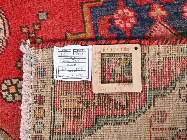 a piece of wood sitting on top of a rug