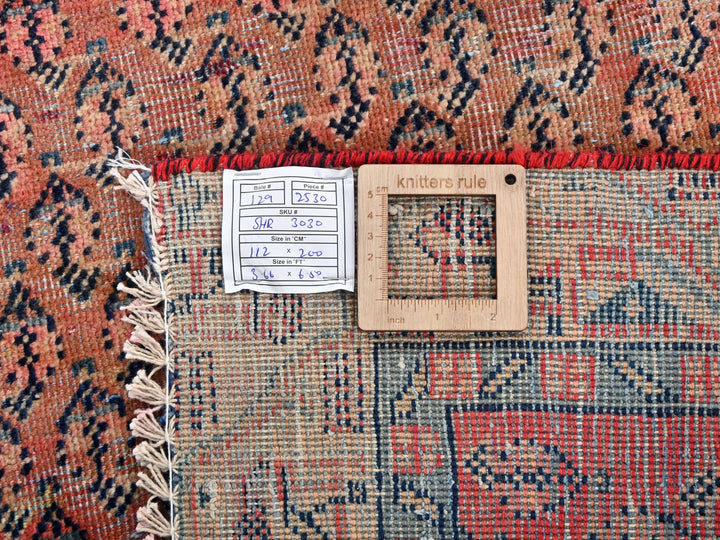 a close up of a rug with a ruler on it