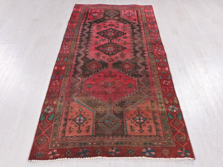 a red rug on a white floor in a room