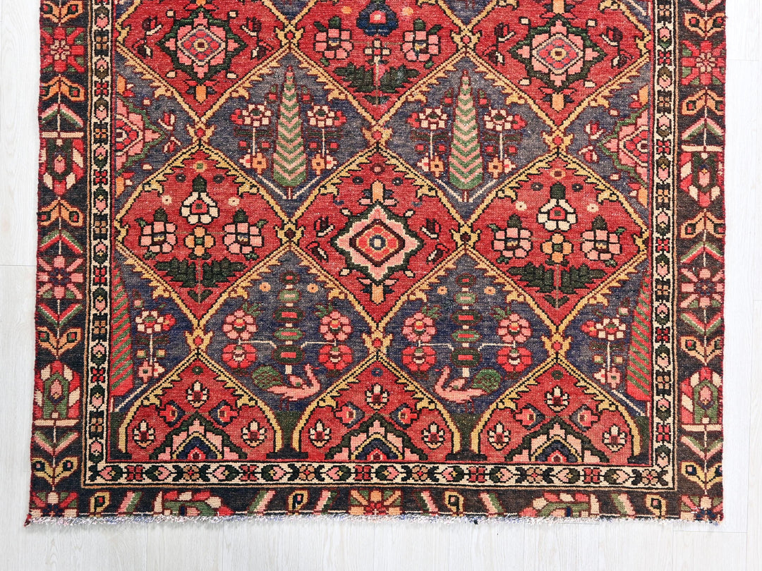 a red and blue rug on a white wall