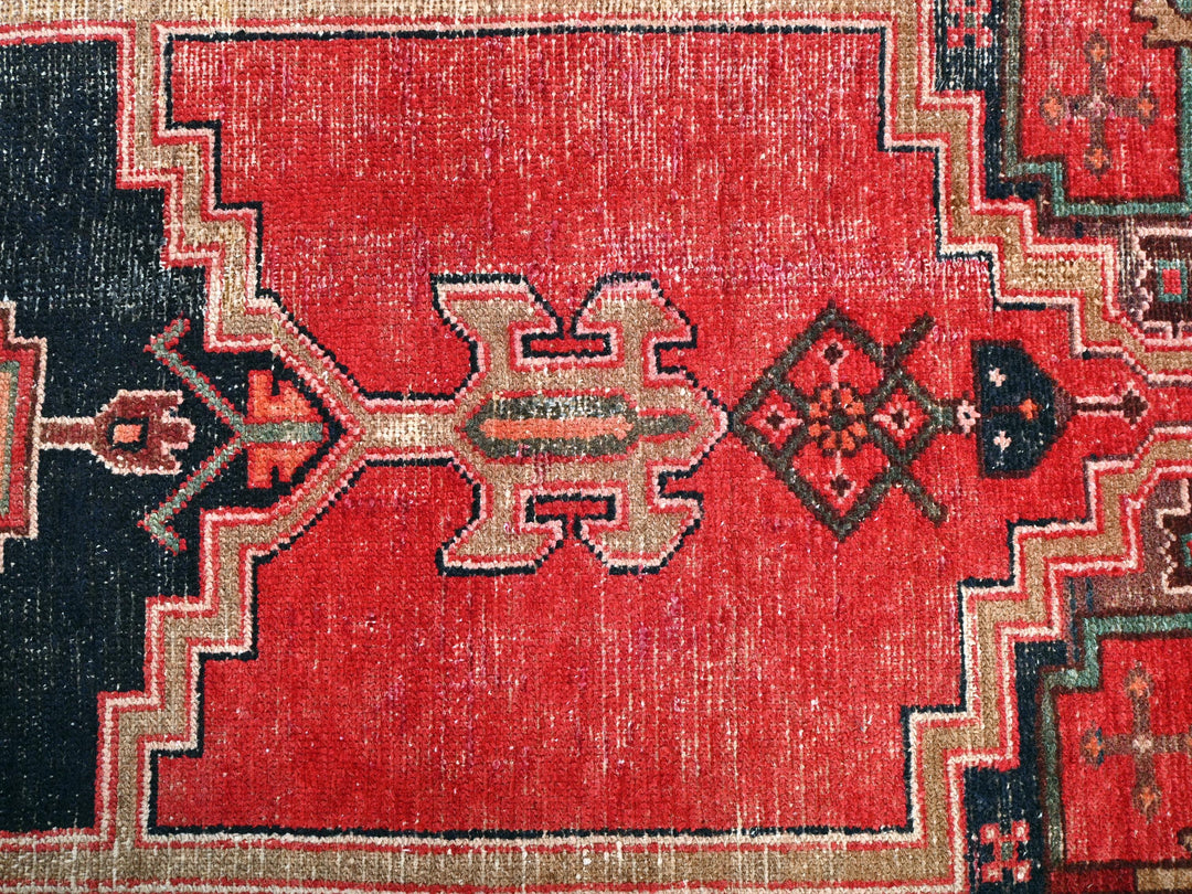 a close up of a red oriental rug