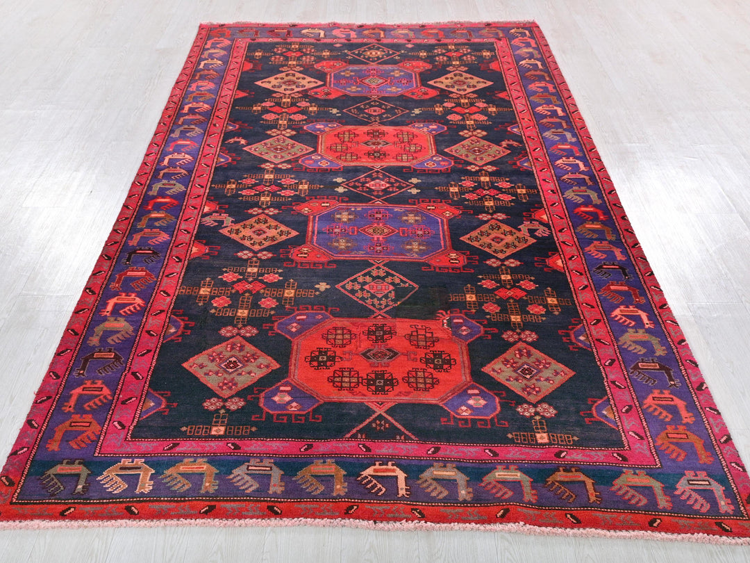 a colorful oriental rug on a white floor