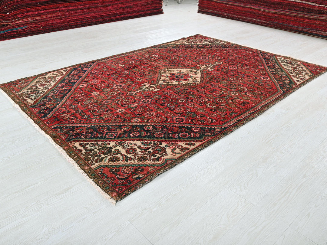 a red rug on a white floor in a room