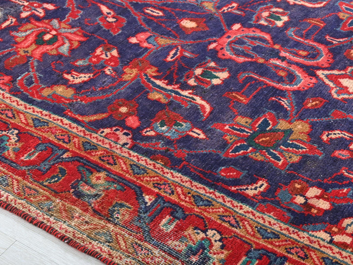 a blue rug with a red and blue design on it