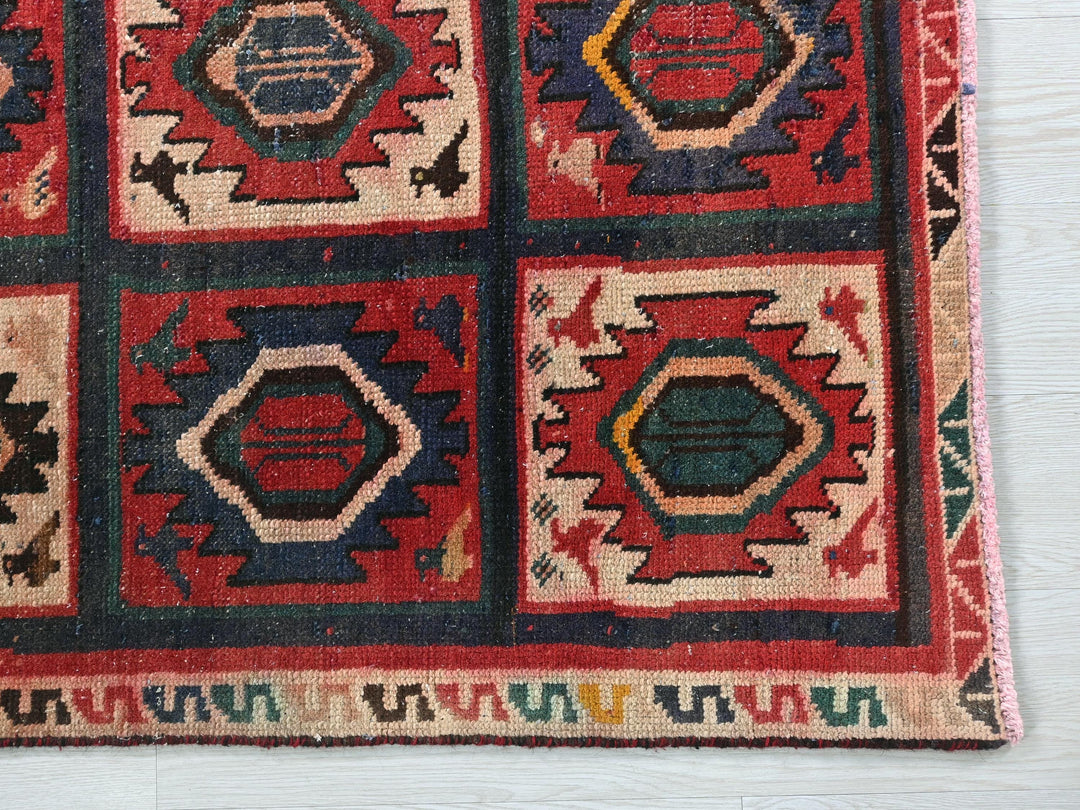 a multicolored rug on a white floor