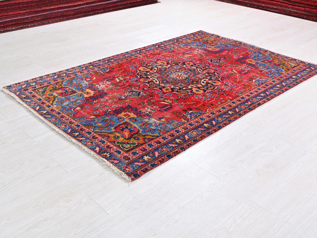 a red rug on the floor of a room