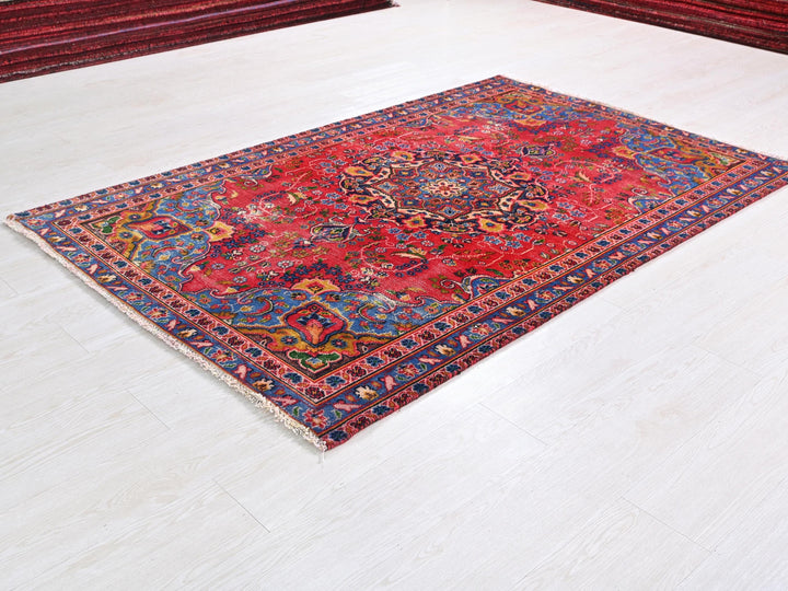a red rug on the floor of a room