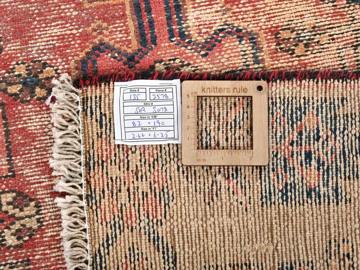 a close up of a rug with a tag on it