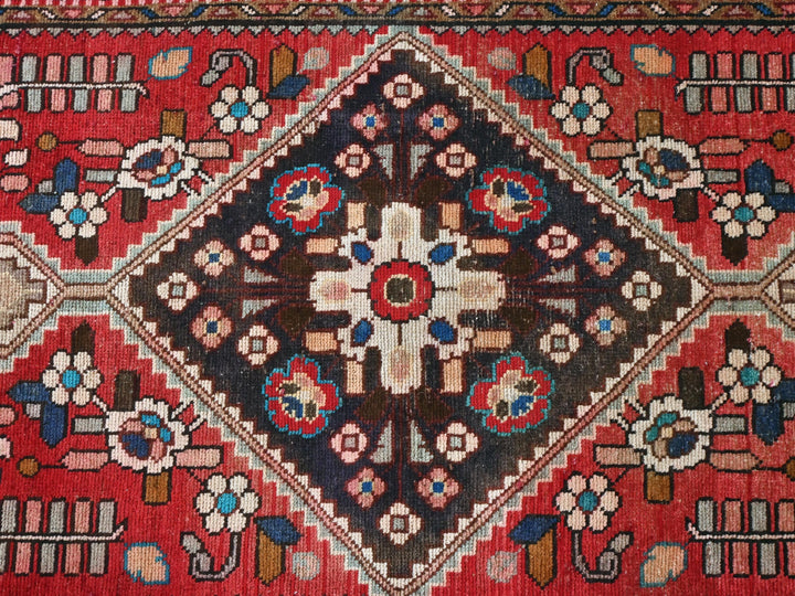 a red rug with a cross on it