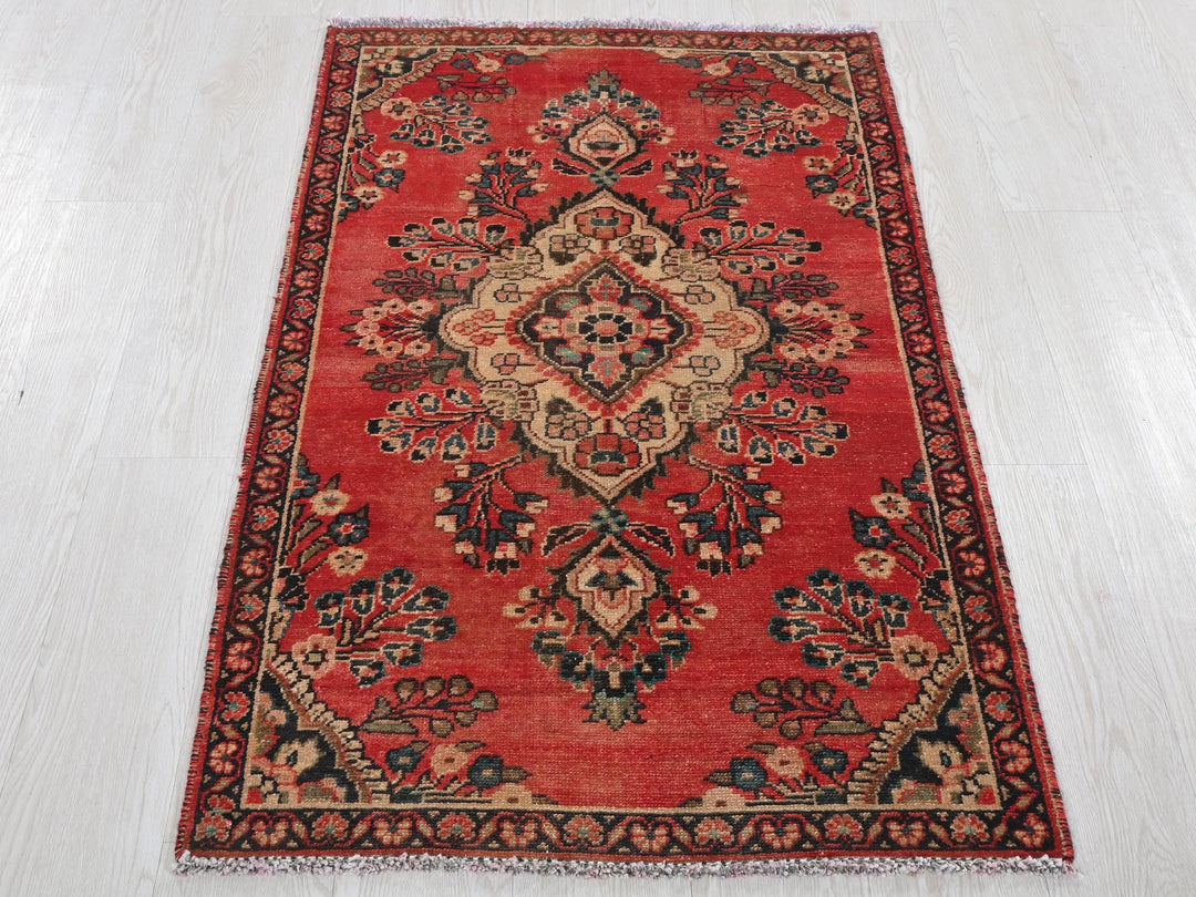 a red rug on a white floor in a room