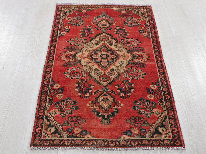 a red rug on a white floor in a room