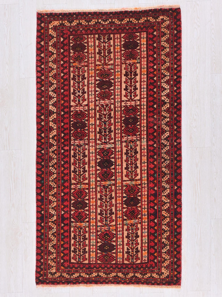 a red rug on a white wooden floor