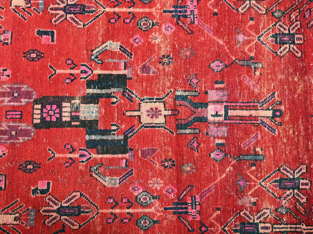 a red rug with a design on it