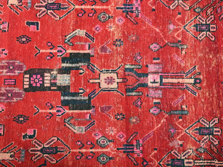a red rug with a design on it