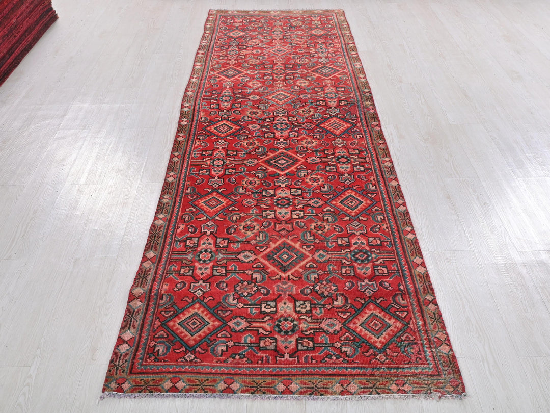 a red rug on a white floor in a room